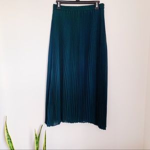 Green pleated skirt